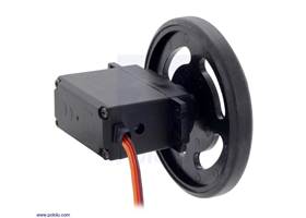 Black Futaba servo wheel mounted on a FEETECH FS5106R continuous rotation servo.