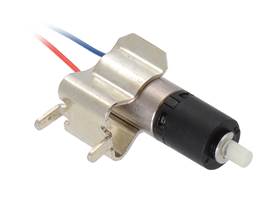 26:1 sub-micro plastic planetary gearmotor being held by a 1/4″ (6&nbsp;mm) fuse clip.
