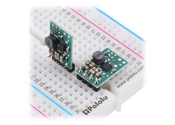 S9V11E2x step-up/step-down voltage regulators, soldered with straight and right-angle headers (not included), on a breadboard.