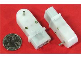Solarbotics GM7 gearmotor with 90-degree shaft, two pieces next to quarter
