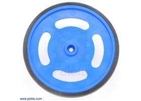 Blue Futaba servo wheel with included rubber band tire.  This view shows the hub designed for Futaba servo splines