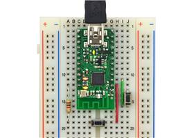 Wixel on breadboard with a bootloader button and reset button connected