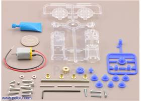 Parts included with the Tamiya 70188 mini motor gearbox (8-speed) kit with quarter for size reference