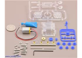 Parts included with the Tamiya 70190 mini motor multi-ratio gearbox (12-speed) kit with quarter for size reference