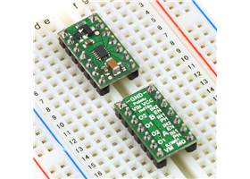 Two DRV8835 dual motor driver carriers plugged into a breadboard