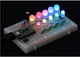 A chain of addressable RGB LEDs (#2535 and #2536) on a breadboard, controlled by an A-Star 32U4 Micro