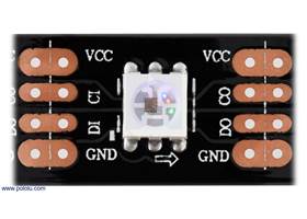 Close up of one segment of an APA102C-based LED strip, with the red, green, and blue LEDs on at a low brightness