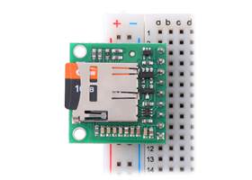 Breakout Board for microSD Card with 3.3V Regulator and Level Shifters plugged into a breadboard with microSD card (not included) inserted