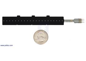 Force-sensing linear potentiometer (4″ FSLP strip) with a US quarter for size reference