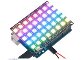 Adafruit NeoPixel Shield with LEDs lit, assembled and connected to an Arduino Uno R3