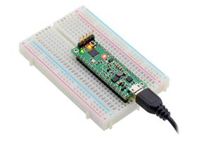 P-Star 45K50 Mini SV on a breadboard, shown with a vertical 5-pin ICSP programming header installed.