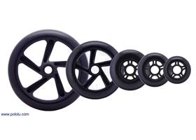 Black scooter/skate wheels with 200&nbsp;mm, 144&nbsp;mm, 100&nbsp;mm, 84&nbsp;mm, and 70&nbsp;mm diameters.