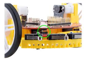 Close-up view of Bumper Switch Assembly male header pins plugged into the female header on the Chassis Board.