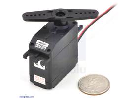 SpringRC SM-S4303R continuous rotation servo with a US quarter for size reference.