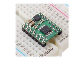 DRV8874/DRV8876 Single Brushed DC Motor Driver Carrier plugged into a breadboard.