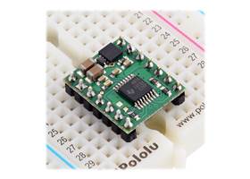 DRV8874/DRV8876 Single Brushed DC Motor Driver Carrier plugged into a breadboard.