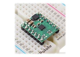 DRV8876 (QFN) Single Brushed DC Motor Driver Carrier plugged into a breadboard.