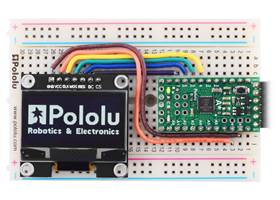 Graphical OLED Display: 128&#215;64, 1.3&quot;, White Pixels, SPI, Black PCB controlled by an A-Star 328PB Micro  running at 3.3V.