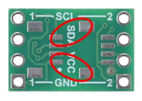 The tightest clearance on the Pololu I²C Isolator ISO1640 is between these sets of pads, which are 2&nbsp;mm apart.