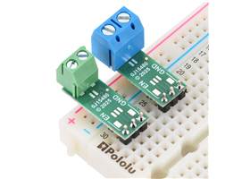 Pololu Isolated Solid State Relay/Switch (SPST) boards soldered with 3.5mm-pitch (left) and 5mm-pitch (right) terminal blocks for load connections and 0.1″ male headers for EN, VIN, and GND control connections.  (Headers and terminal blocks not 