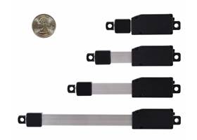 Glideforce GF01 Micro Linear Actuators, retracted, with a US quarter for size reference.