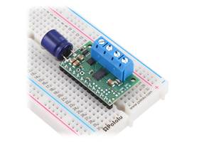 DRV8263H Single Brushed DC Motor Driver Carrier soldered with added input capacitor, 0.1″ headers, and 5mm-pitch terminal blocks (not included).
