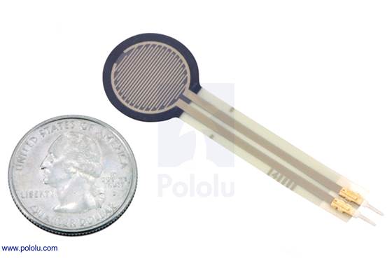 Force-sensing resistor (0.6″ circle) with US quarter for size reference.