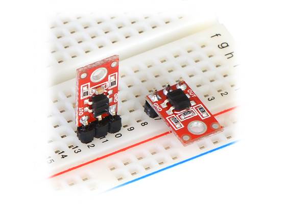 QTR-1A and QTR-1RC reflectance sensors plugged into a breadboard in two possible orientations.