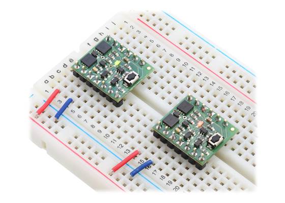 Mini Pushbutton Power Switches in a breadboard (SV version on left and LV version on right).