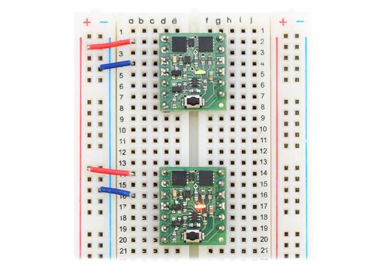 Mini Pushbutton Power Switches in a breadboard (SV version on top and LV version on bottom).
