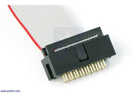 Shrouded 2&#215;8-pin box header with a ribbon cable and IDC connector plugged into it.