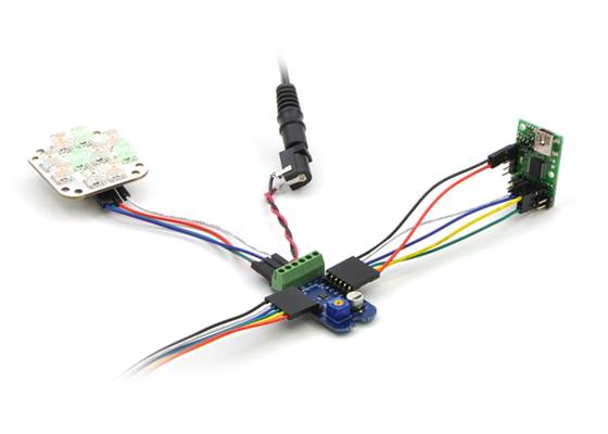 Connecting the Micro Maestro to a chain of ShiftBars.  A single 12V supply powers all of the devices.
