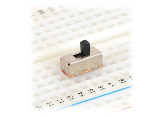 Mini slide switch in a solderless breadboard.