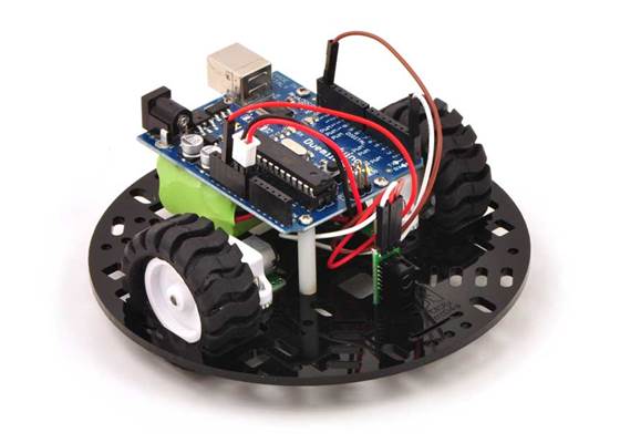 Pololu 5&quot; round robot chassis RRC04A with an Arduino Duemilanove and a Sharp digital distance sensor.