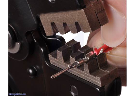 Aligning the crimp pin in the tool.