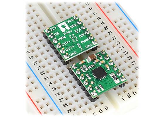 DRV8801 single brushed DC motor driver carriers inserted into a solderless breadboard.