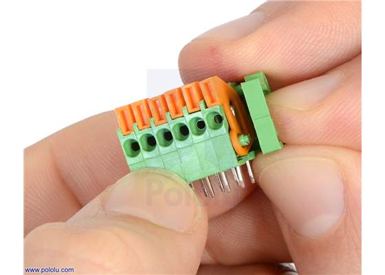Removing the end cap from a 6-pin side-entry screwless terminal block.