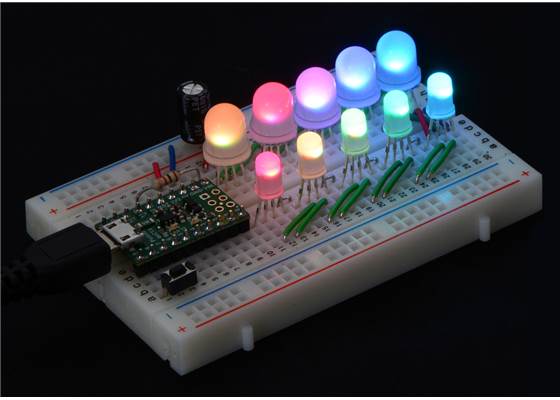 A chain of addressable RGB LEDs (#2535 and #2536) on a breadboard, controlled by an A-Star 32U4 Micro.