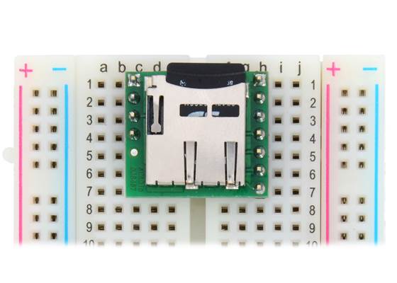 Breakout Board for microSD Card plugged into a breadboard with microSD card (not included) inserted. (1)