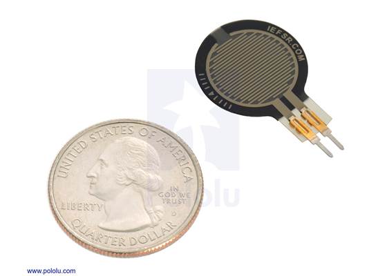 Force-sensing resistor (0.6″-diameter circle, short tail) with a US quarter for size reference.