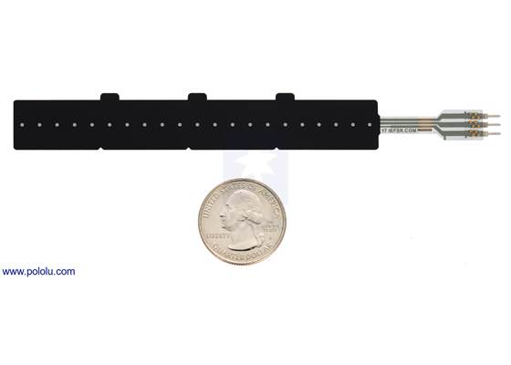 Force-sensing linear potentiometer (4″ FSLP strip) with a US quarter for size reference.