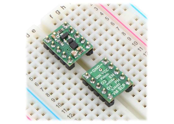 Two DRV8838 Single Brushed DC Motor Driver Carriers plugged into a breadboard.
