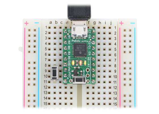 P-Star 25K50 Micro on a breadboard with a reset button (left) and a bootloader button (on-board).