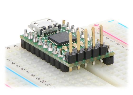 The P-Star 25K50 Micro with a vertical 5-pin programming header installed.