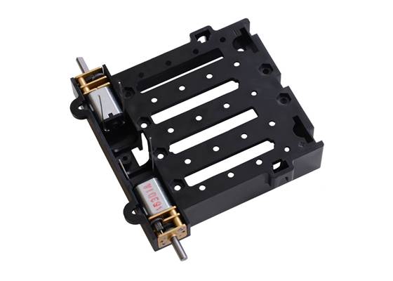 Zumo chassis being assembled with two Micro Metal Gearmotor.