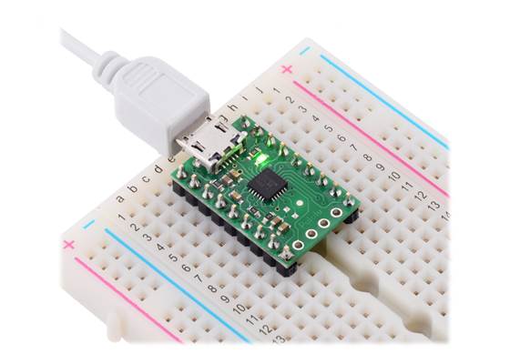 CP2102N USB-to-serial adapter carrier in a breadboard with included 0.1″ male headers installed.