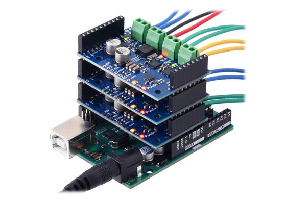 Three Motoron M3S256 shields being controlled by an Arduino Uno.