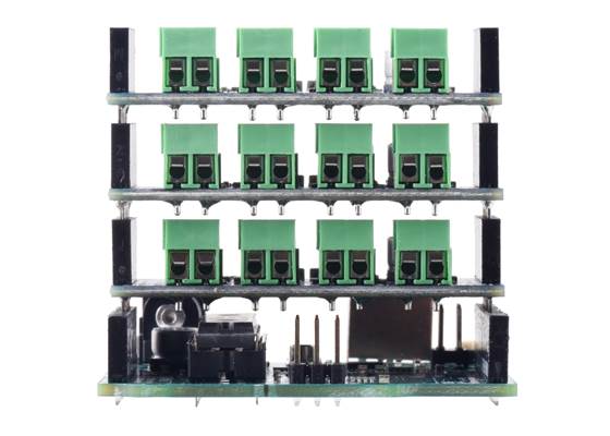 Three Motoron M3S256 or M3S550 shields attached to an Arduino Uno, showing the spacing of the 3.5 mm terminal blocks.