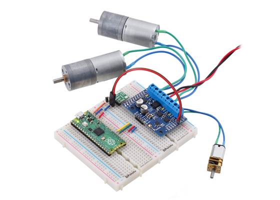 A Raspberry Pi Pico on a breadboard using a Motoron M3S256 shield to control three motors.