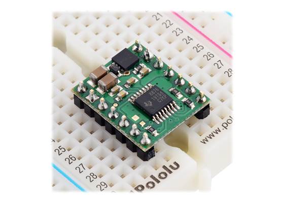 DRV8874/DRV8876 Single Brushed DC Motor Driver Carrier plugged into a breadboard.